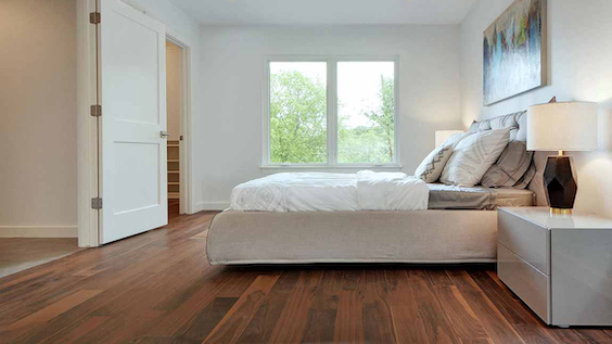 gorgeous hardwood flooring in a minimalist bright bedroom 