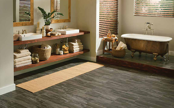 waterproof grey toned luxury vinyl plank flooring in a stylish bathroom sanctuary